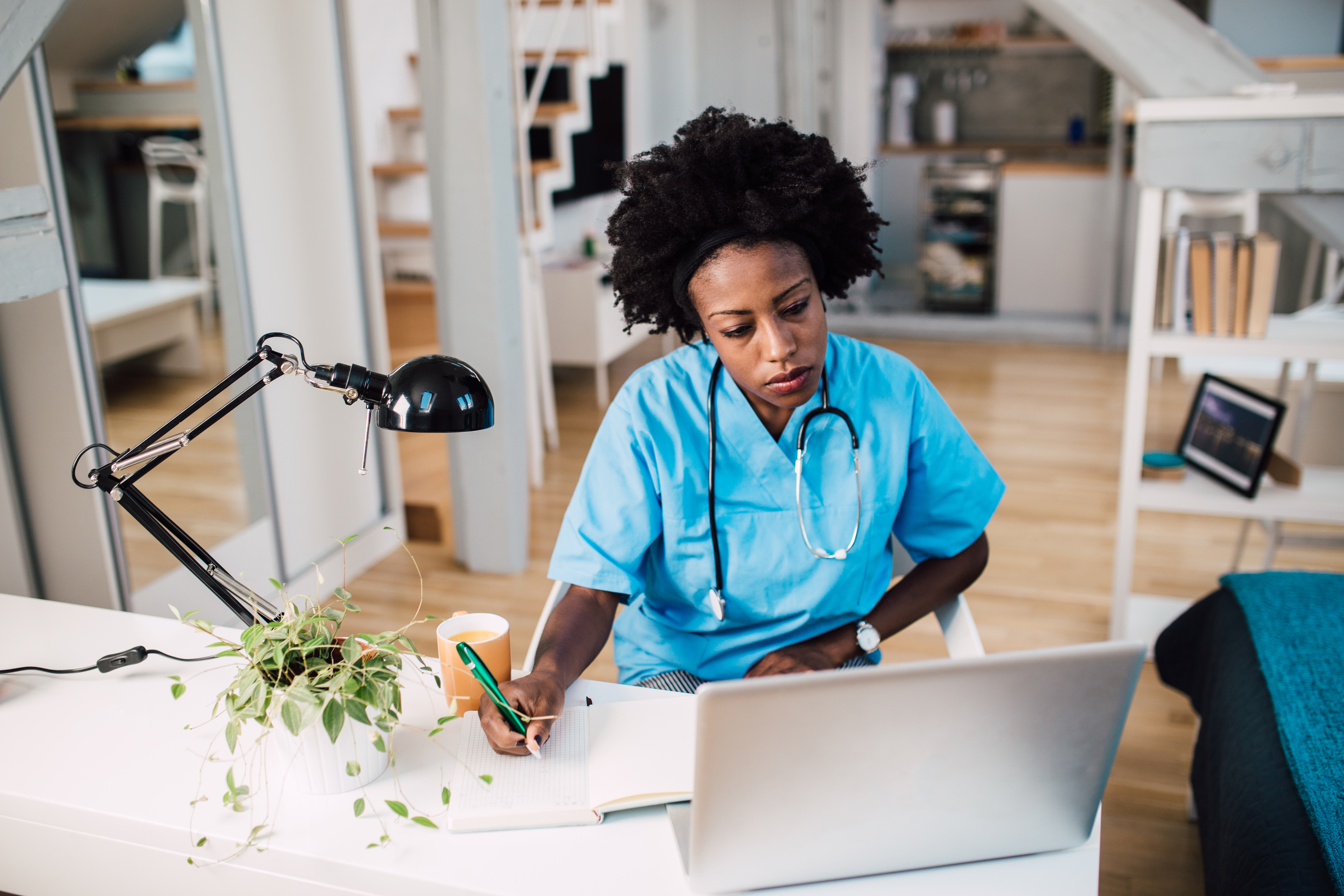Woman physician doing paperwork