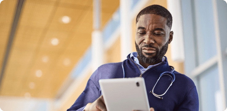 Doctor looking at tablet